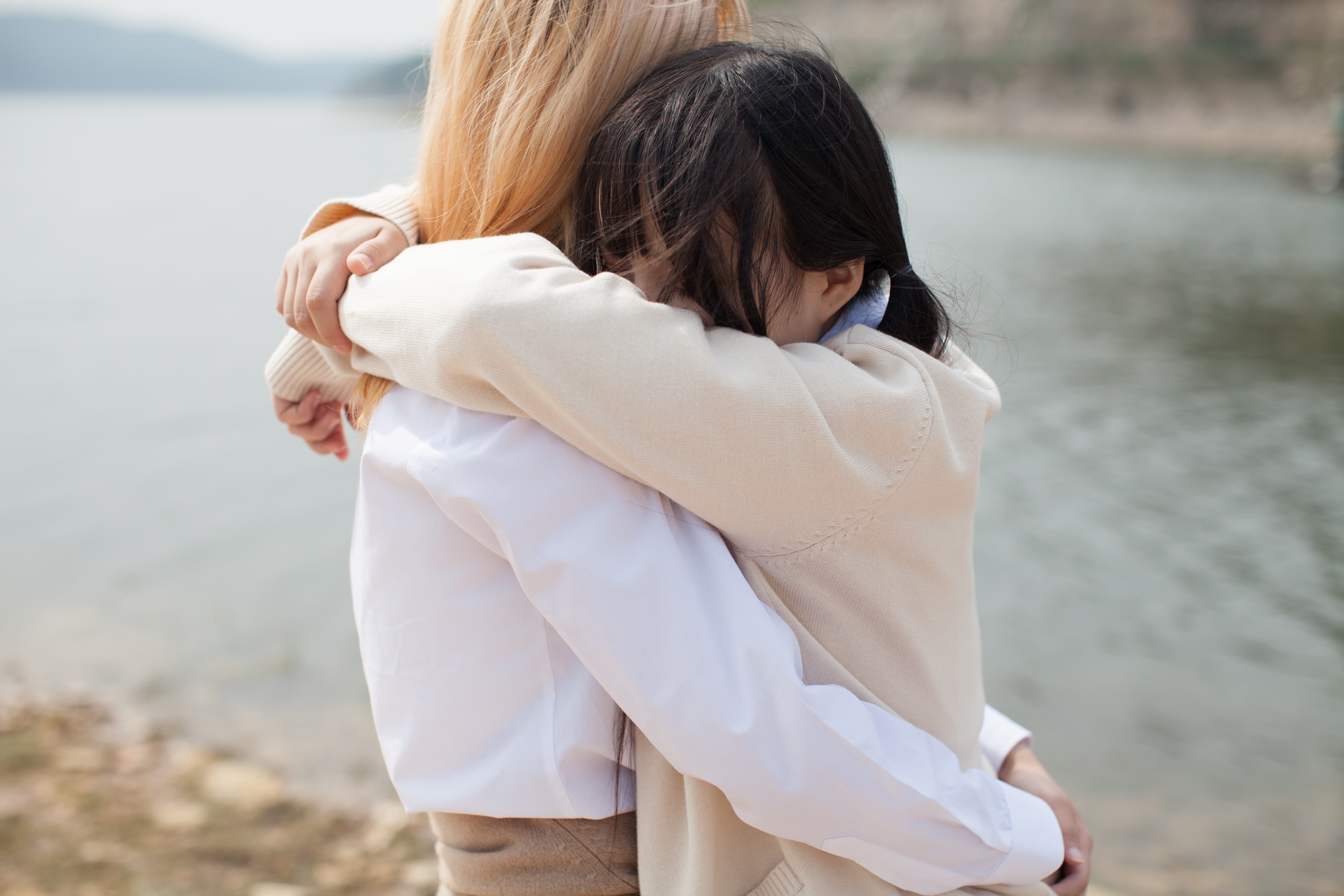 Worn bare soles resting on a train window ledge with stockings rolled down